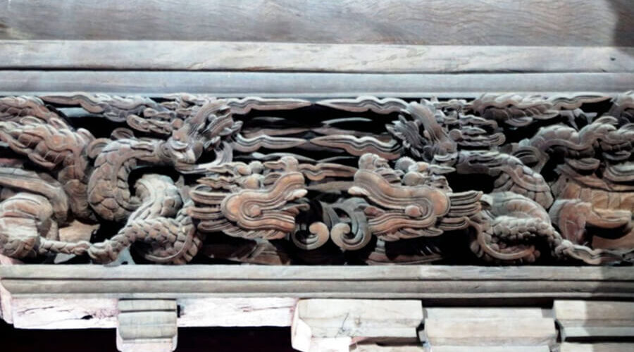 The communal house carved with nearly 400 dragons